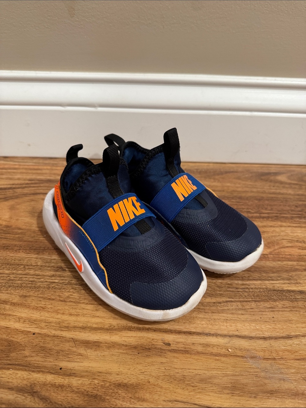 Nike Kids Navy and Orange Slip-On Athletic Sneakers